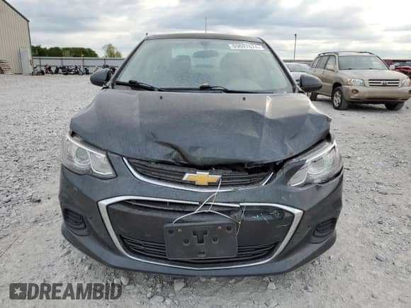 2017 Chevrolet Sonic LS с VIN 1G1JB5SH5H4137673, выставлен на аукционе Copart как лот 69697674 с пробегом 106 229 миль миль и Списание • Salvage title. История ставок и продаж доступна на DreamBid. Изображение 5.
