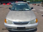 ✅ 2000 Mazda Protege DX • VIN: JM1BJ2228Y0222829 • Лот: 42849407. Опубликован ранее на IAAI с пробегом 228 000 миль. Бесплатный доступ к архиву аукционных продаж из США и подробный отчёт об истории автомобиля на DreamBid. Изображение 6.