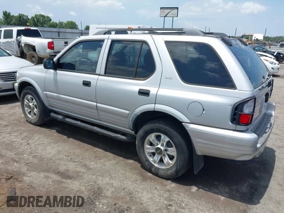 ✅ 2001 Isuzu Rodeo S • VIN: 4S2CK58W914357933 • Lot: 42427142. Listed on IAAI with 129,131 mi. Free auction sales archive from the USA and detailed vehicle history report at DreamBid. Image 3.