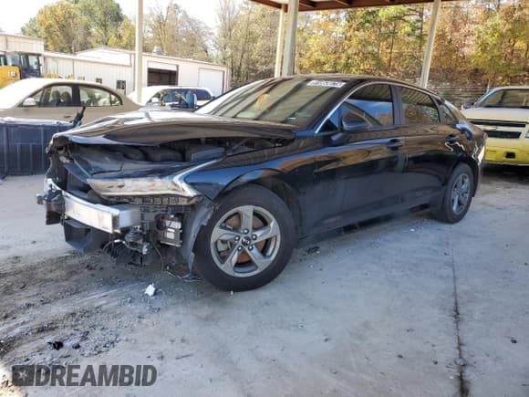 ✅ 2021 Kia K5 LXS • VIN: 5XXG14J22MG017244 • Лот: 91863675. Опубликован ранее на Copart с пробегом 95 573 миль. Бесплатный доступ к архиву аукционных продаж из США и подробный отчёт об истории автомобиля на DreamBid. Изображение 1.