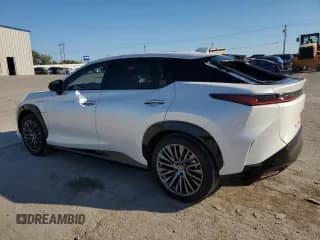 ✅ 2023 Lexus RZ 450e Premium • VIN: JTJAAAAB9PA014293 • Lot: 73701394. Wystawiony na Copart z przebiegiem 5 697 mil. Bezpłatny archiwum sprzedaży aukcyjnych z USA i szczegółowy raport historii pojazdu na DreamBid. Zdjęcie 2.