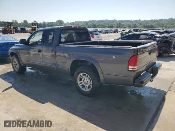 2002 Dodge Dakota Sport z VIN 1B7GL32XX2S588725, wystawiony jako Copart lot #65541345 z przebiegiem 205 568 mil mil oraz Szkoda całkowita • Salvage title. Historia ofert i sprzedaży dostępna na DreamBid. Obrazek 2.