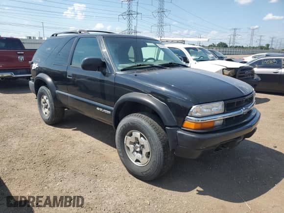 2005 Chevrolet Blazer LS with VIN 1GNCT18X45K101945, listed as a Copart auction lot 62762255 with 160,212 mi miles and Salvage title. Bid and sale history available at DreamBid. Image 4.