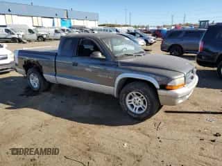 2002 Dodge Dakota SLT z VIN 1B7GL42X72S584170, wystawiony jako Copart lot #77125564 z przebiegiem Nie podano mil oraz Szkoda całkowita • Salvage title. Historia ofert i sprzedaży dostępna na DreamBid. Obrazek 4.