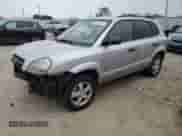 2005 Hyundai Tucson GL z VIN KM8JM12B75U146582, wystawiony jako Copart lot #82966094 z przebiegiem 132 445 mil mil oraz Nie do naprawy • Non repairable. Historia ofert i sprzedaży dostępna na DreamBid. Obrazek 1.