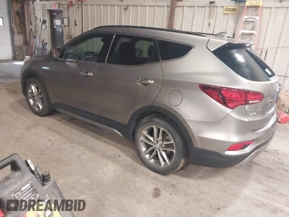 2017 Hyundai Santa Fe 2.0T z VIN 5XYZUDLA4HG424259, wystawiony jako IAAI lot #42657783 z przebiegiem 213 040 mil mil oraz . Historia ofert i sprzedaży dostępna na DreamBid. Obrazek 3.