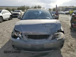 ✅ 2003 Kia Spectra • VIN: KNAFB121935265035 • Лот: 86407934. Опубликован ранее на Copart с пробегом 201 586 миль. Бесплатный доступ к архиву аукционных продаж из США и подробный отчёт об истории автомобиля на DreamBid. Изображение 5.