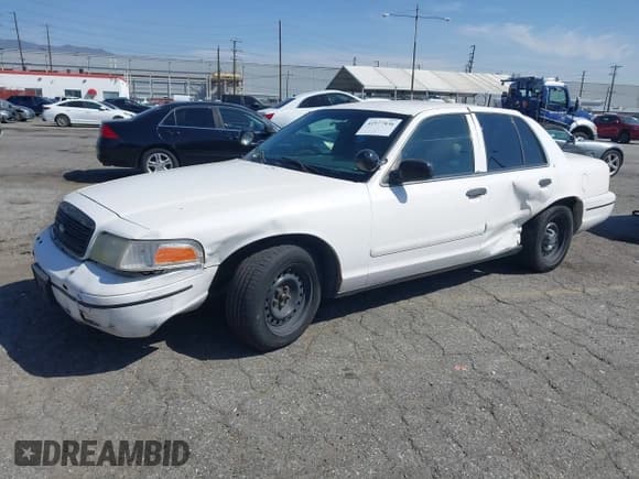 ✅ 1999 Ford Crown Victoria Police • VIN: 2FAFP71W1XX200937 • Лот: 41977836. Опубликован ранее на IAAI с пробегом 186 379 миль. Бесплатный доступ к архиву аукционных продаж из США и подробный отчёт об истории автомобиля на DreamBid. Изображение 2.