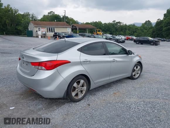 ✅ 2013 Hyundai Elantra GLS • VIN: KMHDH4AE8DU829579 • Lot: 42940329. Listed on IAAI with 153,115 mi. Free auction sales archive from the USA and detailed vehicle history report at DreamBid. Image 4.