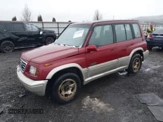✅ 1996 Suzuki Sidekick • VIN: JS3TD21V0T4107927 • Lot: 41249522. Listed on IAAI with 225,665 mi. Free auction sales archive from the USA and detailed vehicle history report at DreamBid. Image 2.
