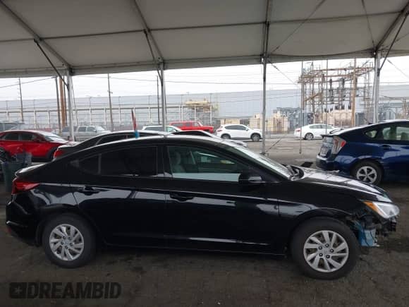2019 Hyundai Elantra SE z VIN 5NPD74LF2KH487647, wystawiony jako IAAI lot #42182698 z przebiegiem 108 092 mil mil oraz . Historia ofert i sprzedaży dostępna na DreamBid. Obrazek 14.