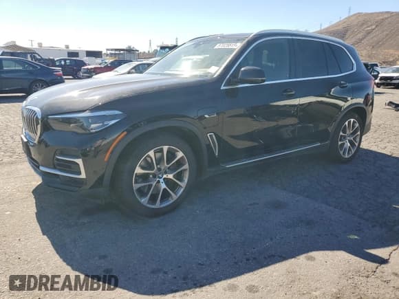 ✅ 2023 BMW X5 xDrive45e • VIN: 5UXTA6C03P9N92460 • Лот: 87025515. Опубликован ранее на Copart с пробегом 65 068 миль. Бесплатный доступ к архиву аукционных продаж из США и подробный отчёт об истории автомобиля на DreamBid. Изображение 1.