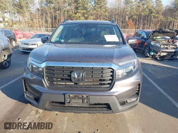 ✅ 2022 Honda Ridgeline RTL • VIN: 5FPYK3F52NB002849 • Lot: 43720277. Listed on IAAI with 71,325 mi. Free auction sales archive from the USA and detailed vehicle history report at DreamBid. Image 12.