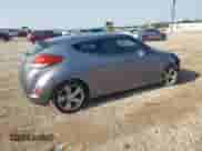 2015 Hyundai Veloster z VIN KMHTC6AD6FU227456, wystawiony jako Copart lot #66915114 z przebiegiem 83 266 mil mil oraz Szkoda całkowita • Salvage title. Historia ofert i sprzedaży dostępna na DreamBid. Obrazek 3.