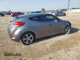 2015 Hyundai Veloster z VIN KMHTC6AD6FU227456, wystawiony jako Copart lot #66915114 z przebiegiem 83 266 mil mil oraz Szkoda całkowita • Salvage title. Historia ofert i sprzedaży dostępna na DreamBid. Obrazek 3.