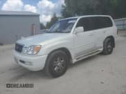 ✅ 1998 Lexus LX 470 • VIN: JT6HT00W1W0023754 • Lot: 55124585. Listed on Copart with 153,150 mi. Free auction sales archive from the USA and detailed vehicle history report at DreamBid. Image 1.