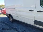 ✅ 2023 Ford Transit Cargo • VIN: 1FTBR2C8XPKA33372 • Lot: 41735299. Listed on IAAI with 56,777 mi. Free auction sales archive from the USA and detailed vehicle history report at DreamBid. Image 6.