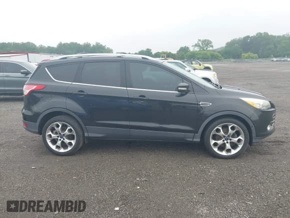 ✅ 2015 Ford Escape Titanium • VIN: 1FMCU0JX7FUB00462 • Lot: 42532943. Listed on IAAI with 88,623 mi. Free auction sales archive from the USA and detailed vehicle history report at DreamBid. Image 13.