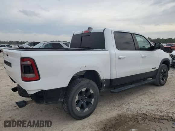 2020 Ram 1500 Rebel z VIN 1C6RRELT2LN303523, wystawiony jako Copart lot #54753485 z przebiegiem 90 533 mil mil oraz Szkoda całkowita • Salvage title. Historia ofert i sprzedaży dostępna na DreamBid. Obrazek 3.