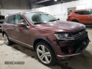 ✅ 2017 Volkswagen Touareg Executive • VIN: WVGGF7BP5HD001497 • Lot: 39641554. Listed on Copart with 81,525 mi. Free auction sales archive from the USA and detailed vehicle history report at DreamBid. Image 4.