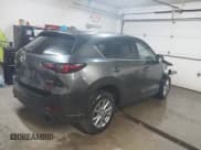 ✅ 2022 Mazda CX-5 S Carbon Edition • VIN: JM3KFBCM1N0577670 • Лот: 43821338. Опубликован ранее на IAAI с пробегом 59 967 миль. Бесплатный доступ к архиву аукционных продаж из США и подробный отчёт об истории автомобиля на DreamBid. Изображение 4.