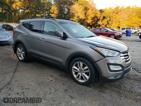 ✅ 2015 Hyundai Santa Fe • VIN: 5XYZWDLA7FG275479 • Lot: 91111245. Listed on Copart with 104,919 mi. Free auction sales archive from the USA and detailed vehicle history report at DreamBid. Image 4.