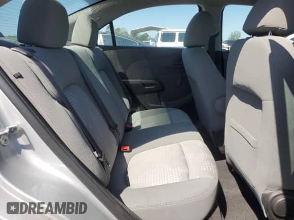 2017 Chevrolet Sonic LS z VIN 1G1JA5SH0H4171085, wystawiony jako Copart lot #52207145 z przebiegiem 26 933 mil mil oraz Szkoda całkowita • Salvage title. Historia ofert i sprzedaży dostępna na DreamBid. Obrazek 11.