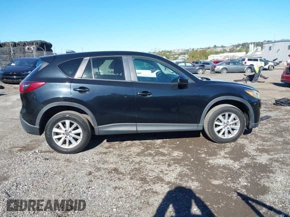 ✅ 2014 Mazda CX-5 Touring • VIN: JM3KE4CY9E0309225 • Lot: 43452274. Listed on IAAI with 175,973 mi. Free auction sales archive from the USA and detailed vehicle history report at DreamBid. Image 13.