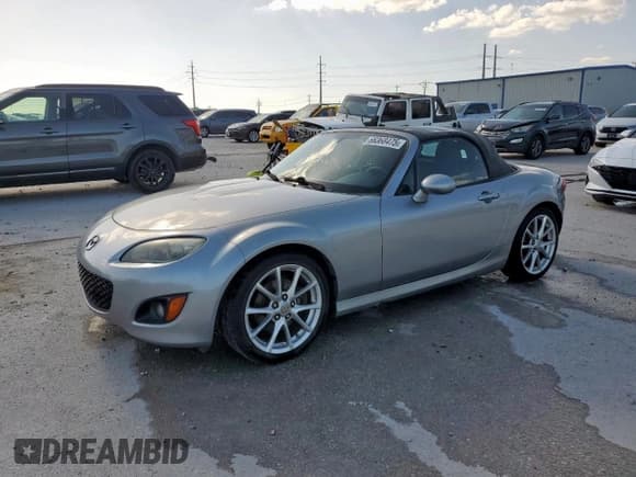 ✅ 2011 Mazda MX-5 Miata Touring • VIN: JM1NC2LF6B0219573 • Lot: 66368475. Listed on Copart with 86,727 mi. Free auction sales archive from the USA and detailed vehicle history report at DreamBid. Image 1.