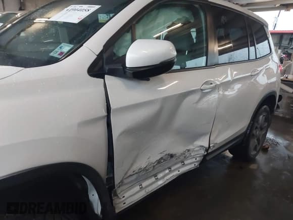 ✅ 2023 Honda Passport EX-L • VIN: 5FNYF8H5XPB023040 • Lot: 41904058. Listed on IAAI with 69,834 mi. Free auction sales archive from the USA and detailed vehicle history report at DreamBid. Image 6.