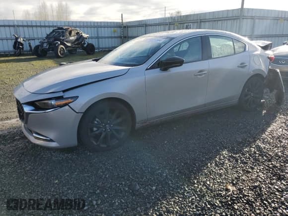 ✅ 2022 Mazda 3 2.5 Turbo • VIN: 3MZBPBAY9NM306877 • Lot: 87252804. Listed on Copart with 21,724 mi. Free auction sales archive from the USA and detailed vehicle history report at DreamBid. Image 1.