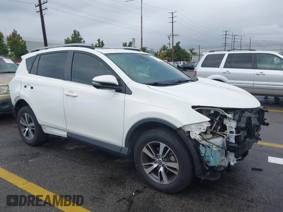 ✅ 2018 Toyota RAV4 XLE • VIN: JTMWFREV0JJ198642 • Lot: 43762062. Listed on IAAI with 90,928 mi. Free auction sales archive from the USA and detailed vehicle history report at DreamBid. Image 1.