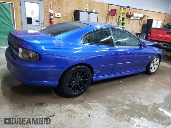 ✅ 2004 Pontiac GTO • VIN: 6G2VX12G94L209153 • Lot: 77960994. Listed on Copart with 52,868 mi. Free auction sales archive from the USA and detailed vehicle history report at DreamBid. Image 3.