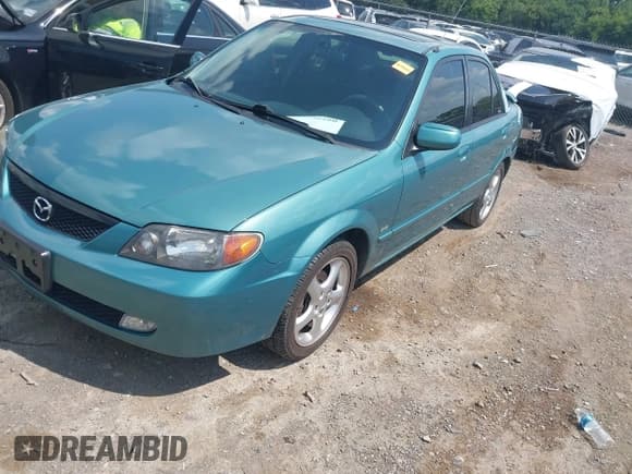 ✅ 2002 Mazda Protege DX • VIN: JM1BJ225120524478 • Lot: 42752160. Listed on IAAI with 193,561 mi. Free auction sales archive from the USA and detailed vehicle history report at DreamBid. Image 2.