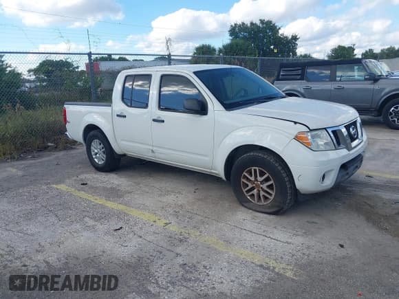 ✅ 2019 Nissan Frontier SV • VIN: 1N6AD0ER2KN879116 • Lot: 43570482. Listed on IAAI with 135,666 mi. Free auction sales archive from the USA and detailed vehicle history report at DreamBid. Image 1.