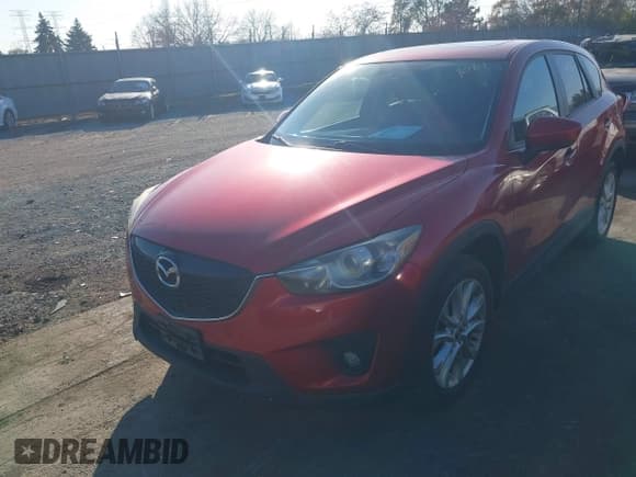 ✅ 2014 Mazda CX-5 Grand Touring • VIN: JM3KE4DY0E0363009 • Lot: 43713061. Listed on IAAI with 105,703 mi. Free auction sales archive from the USA and detailed vehicle history report at DreamBid. Image 2.