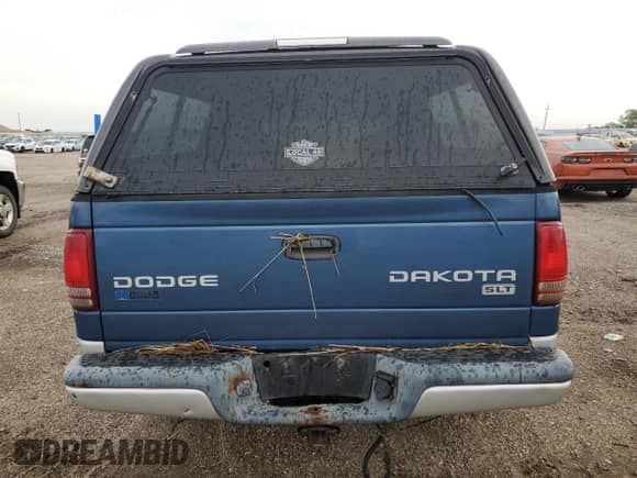 2004 Dodge Dakota SLT z VIN 1D7HG48N04S695750, wystawiony jako Copart lot #61059154 z przebiegiem Nie podano mil oraz Szkoda całkowita • Salvage title. Historia ofert i sprzedaży dostępna na DreamBid. Obrazek 6.