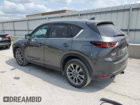 ✅ 2021 Mazda CX-5 Signature • VIN: JM3KFBEYXM0414787 • Лот: 64575355. Опубликован ранее на Copart с пробегом 90 199 миль. Бесплатный доступ к архиву аукционных продаж из США и подробный отчёт об истории автомобиля на DreamBid. Изображение 2.
