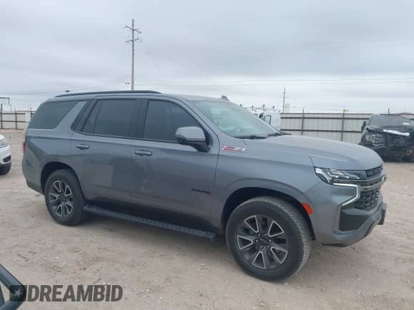 2022 Chevrolet Tahoe Z71 z VIN 1GNSKPKD3NR304672, wystawiony jako IAAI lot #41316391 z przebiegiem 70 380 mil mil oraz . Historia ofert i sprzedaży dostępna na DreamBid. Obrazek 14.