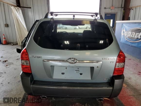 2006 Hyundai Tucson GLS with VIN KM8JN72D26U346076, listed as a Copart auction lot 77447474 with 123,993 mi miles and Salvage title. Bid and sale history available at DreamBid. Image 6.