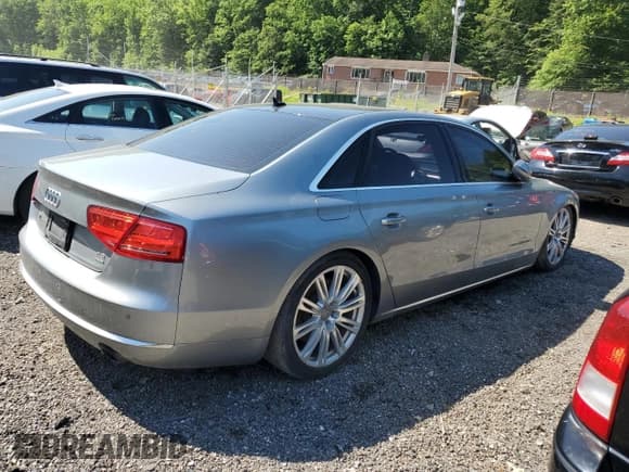 ✅ 2012 Audi A8 • VIN: WAURVAFDXCN001167 • Lot: 57227105. Listed on Copart with 154,409 mi. Free auction sales archive from the USA and detailed vehicle history report at DreamBid. Image 3.