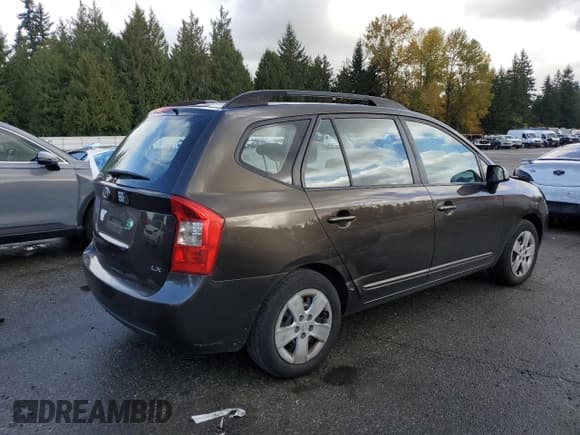 ✅ 2009 Kia Rondo LX • VIN: KNAFG528297269155 • Лот: 90724425. Опубликован ранее на Copart с пробегом 184 346 миль. Бесплатный доступ к архиву аукционных продаж из США и подробный отчёт об истории автомобиля на DreamBid. Изображение 3.