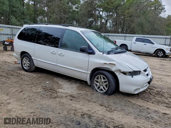 ✅ 1999 Dodge Caravan SE • VIN: 1B4GP44G1XB607352 • Lot: 94891865. Listed on Copart with 83,023 mi. Free auction sales archive from the USA and detailed vehicle history report at DreamBid. Image 4.