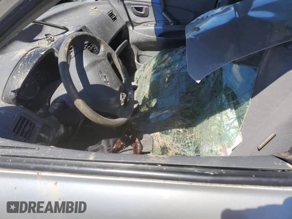 2005 Hyundai Tucson GL z VIN KM8JM12B25U076246, wystawiony jako Copart lot #54030704 z przebiegiem Nie podano mil oraz Szkoda całkowita • Salvage title. Historia ofert i sprzedaży dostępna na DreamBid. Obrazek 7.