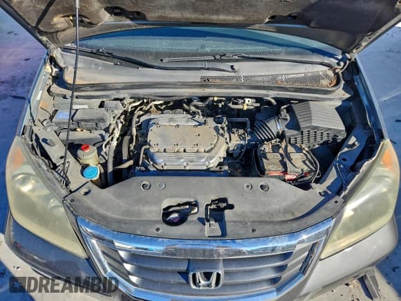 ✅ 2010 Honda Odyssey EX-L • VIN: 5FNRL3H68AB034103 • Lot: 95981635. Listed on Copart with 126,963 mi. Free auction sales archive from the USA and detailed vehicle history report at DreamBid. Image 12.