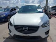 ✅ 2016 Mazda CX-5 Touring • VIN: JM3KE2CY0G0694939 • Lot: 43401057. Wystawiony na IAAI z przebiegiem 125 867 mil. Bezpłatny archiwum sprzedaży aukcyjnych z USA i szczegółowy raport historii pojazdu na DreamBid. Zdjęcie 12.