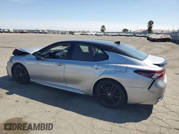 2021 Toyota Camry Hybrid XSE с VIN 4T1K31AK3MU021277, выставлен на аукционе Copart как лот 70713925 с пробегом 110 295 миль миль и Списание • Salvage title. История ставок и продаж доступна на DreamBid. Изображение 2.