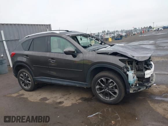 ✅ 2016 Mazda CX-5 Grand Touring • VIN: JM3KE4DY2G0763608 • Lot: 43864275. Wystawiony na IAAI z przebiegiem 95 452 mil. Bezpłatny archiwum sprzedaży aukcyjnych z USA i szczegółowy raport historii pojazdu na DreamBid. Zdjęcie 14.