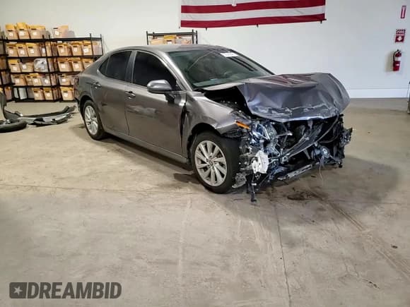 ✅ 2022 Toyota Camry LE • VIN: 4T1C11AK8NU674134 • Лот: 92382645. Опубликован ранее на Copart с пробегом 103 215 миль. Бесплатный доступ к архиву аукционных продаж из США и подробный отчёт об истории автомобиля на DreamBid. Изображение 14.