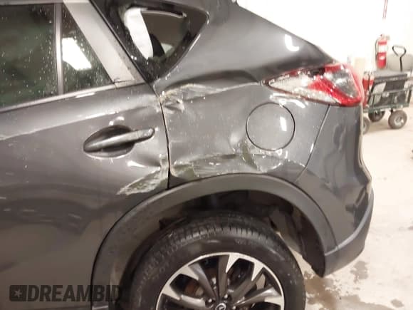 ✅ 2016 Mazda CX-5 Grand Touring • VIN: JM3KE4DY4G0679077 • Lot: 43560857. Wystawiony na IAAI z przebiegiem 83 348 mil. Bezpłatny archiwum sprzedaży aukcyjnych z USA i szczegółowy raport historii pojazdu na DreamBid. Zdjęcie 6.